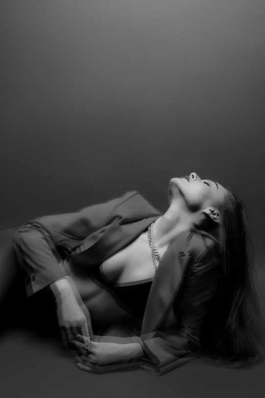 Monochrome Photo of Woman with her Head Up 